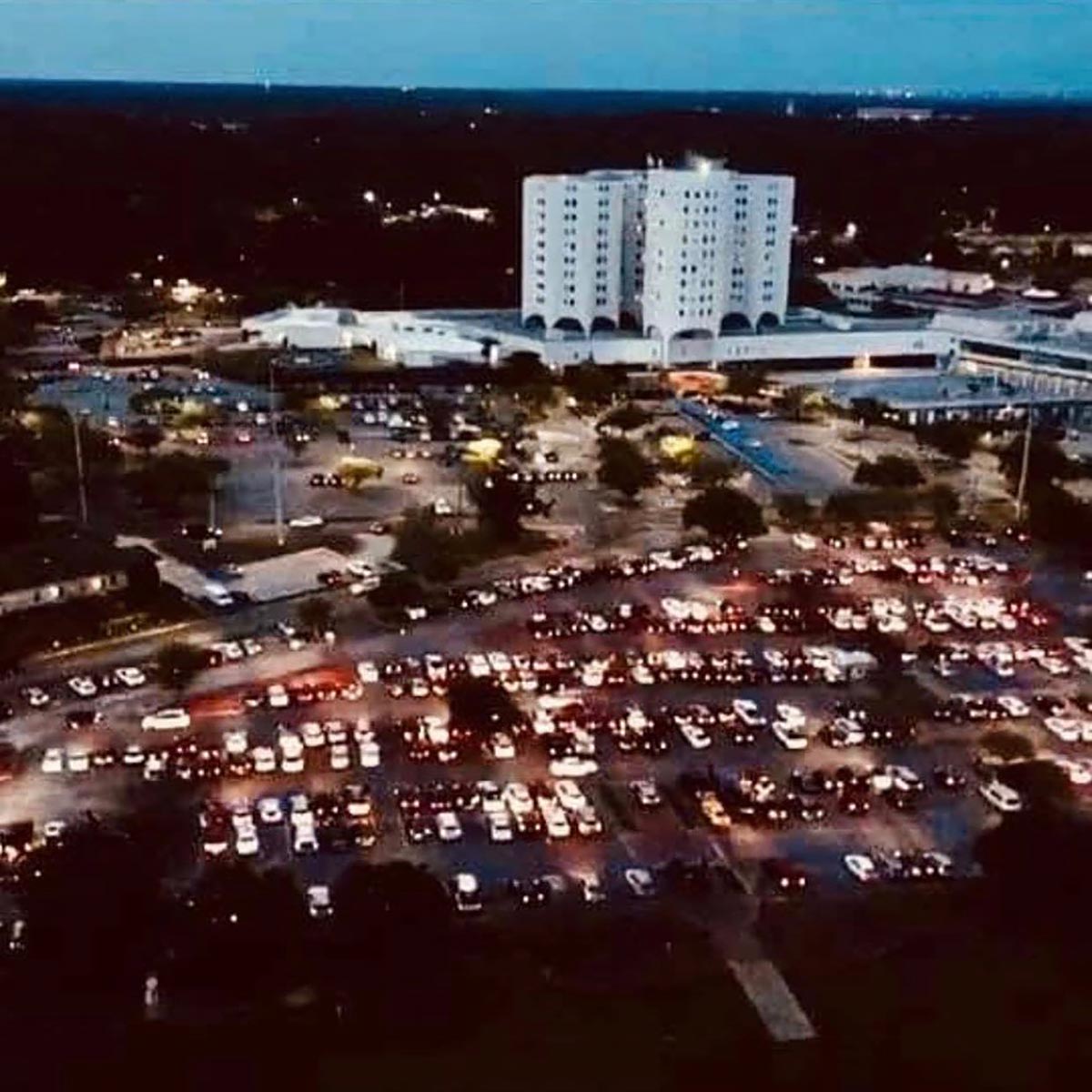 People gather in parking lots for COVID-19 prayer vigils