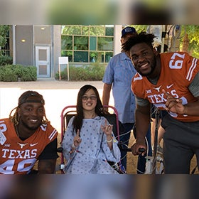 Pediatric patients go fishing with college football players