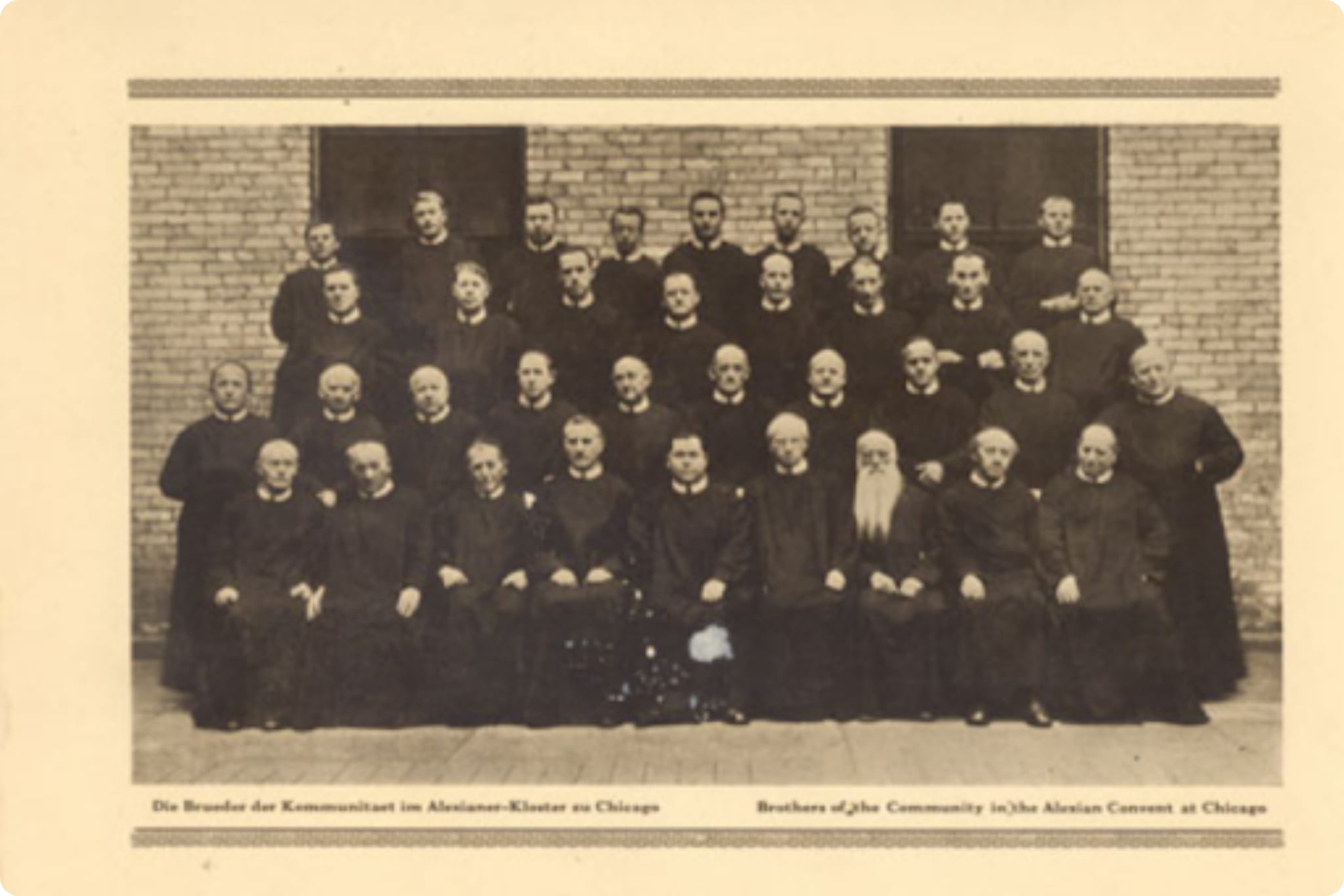 Historic black and white photo of over thirty men from the Alexian Brothers community posing in rows against a brick wall. German and English text below reads, "Brothers of the Community in the Alexian Convent at Chicago."