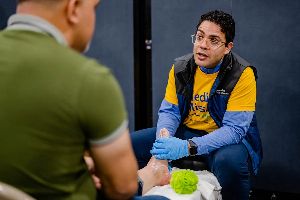 Volunteer assisting patient