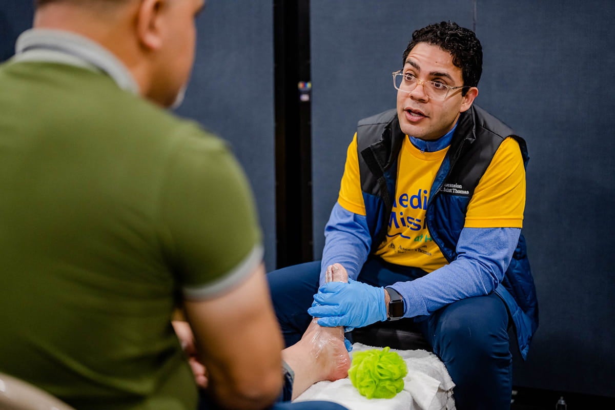 Volunteer assisting patient