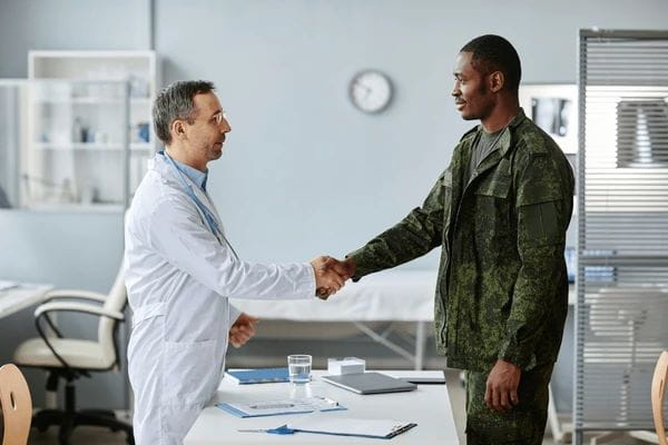 Woman with cancer speaks with her doctor.