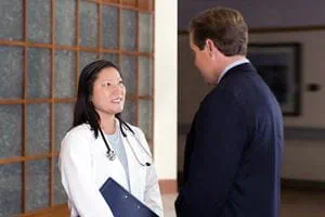 Doctor and business man talking
