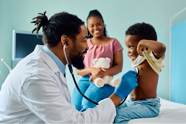 Doctor examining a small child