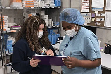 Health professionals looking at a chart